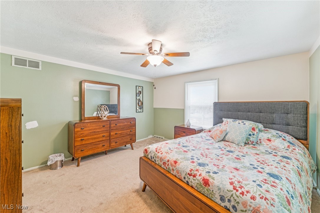 2911 Lee Road Cleveland, OH 44120 - Photo 24 of 50 Carpeted bedroom with a textured ceiling and a ceiling fan