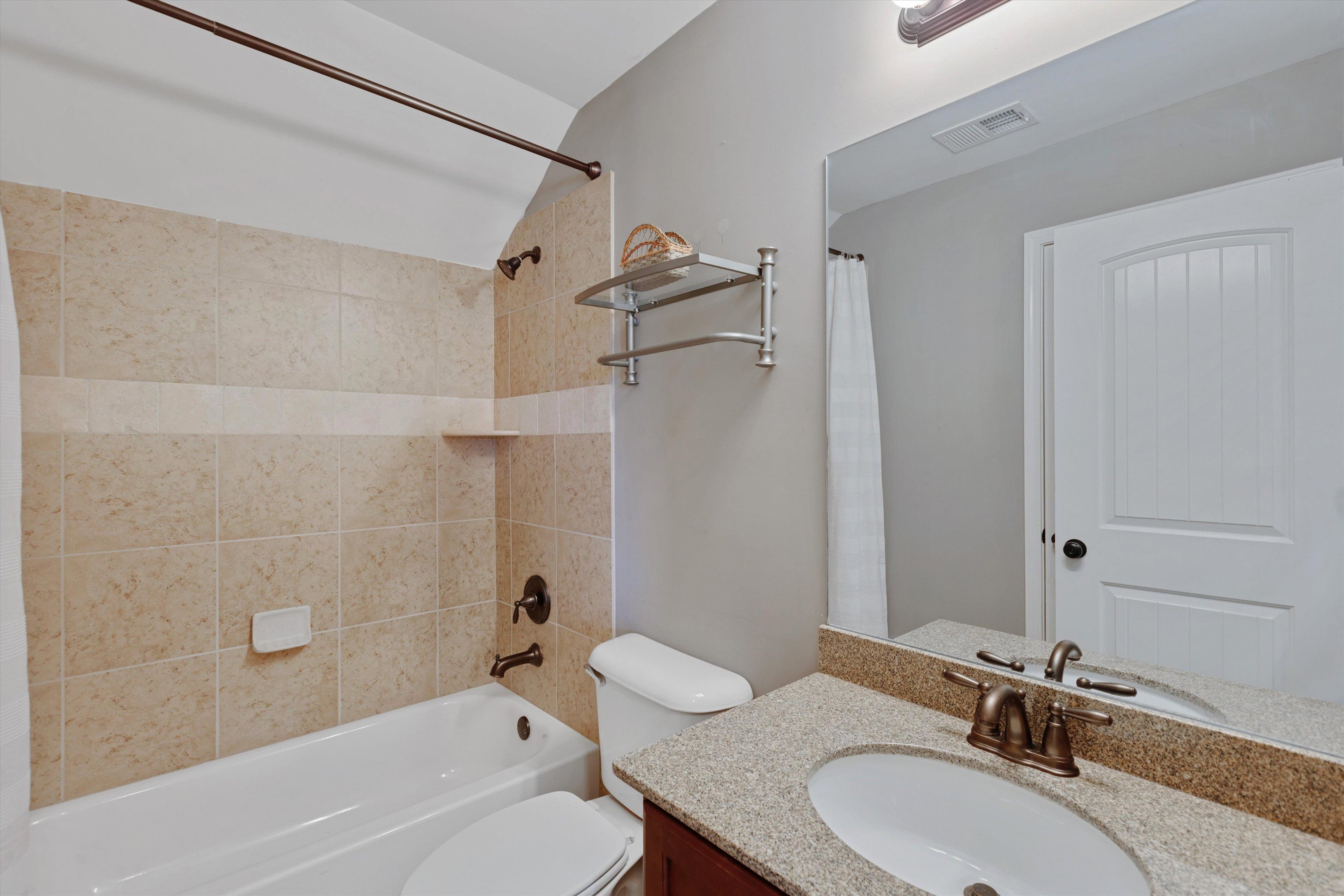6005 Maher Valley Cove Bartlett, TN 38135 - Photo 22 of 28 a bathroom with a granite countertop sink toilet and shower
