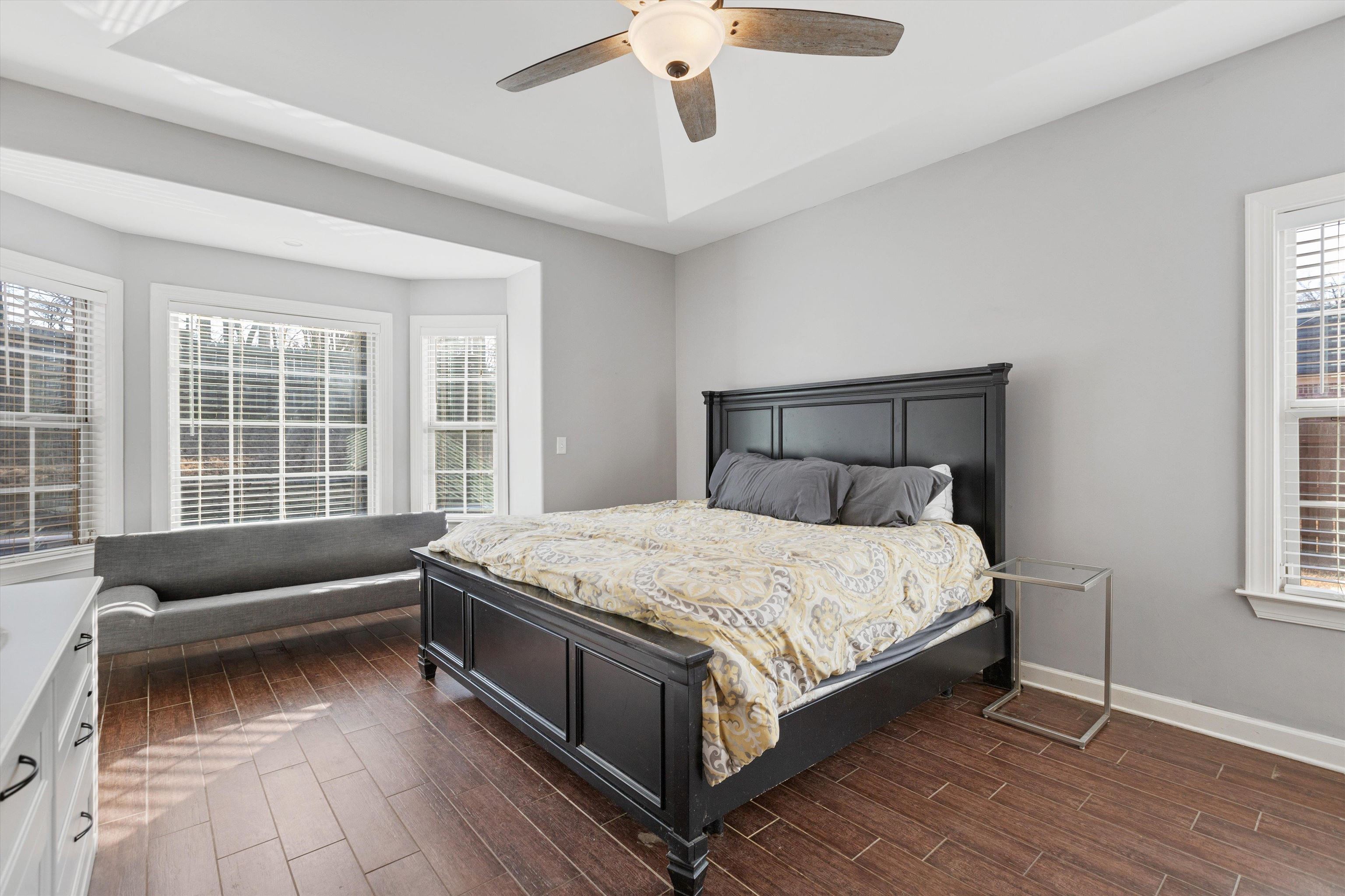 6005 Maher Valley Cove Bartlett, TN 38135 - Photo 4 of 28 a bed sitting in a bedroom next to a window