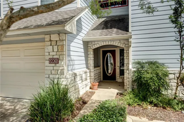 a view of a patio with table and chairs and potted plants