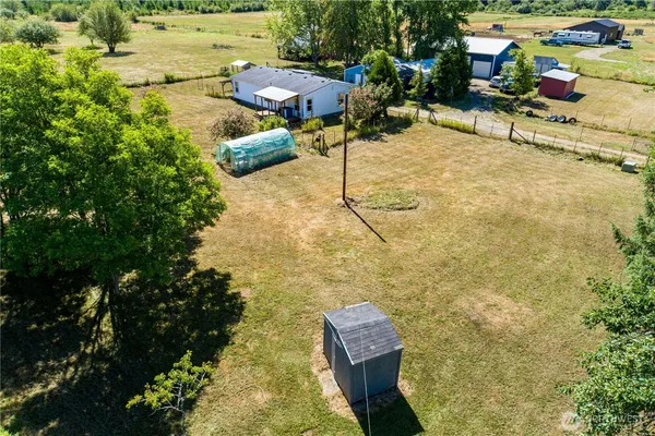 a view of a swimming pool with a yard