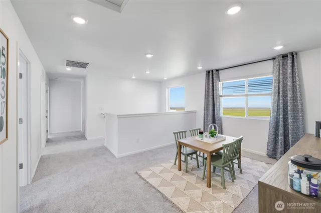 a view of a dining room with furniture