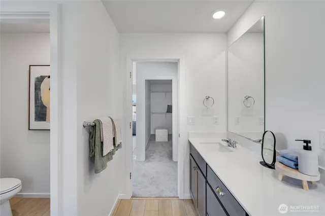 a bathroom with a double vanity sink and a mirror