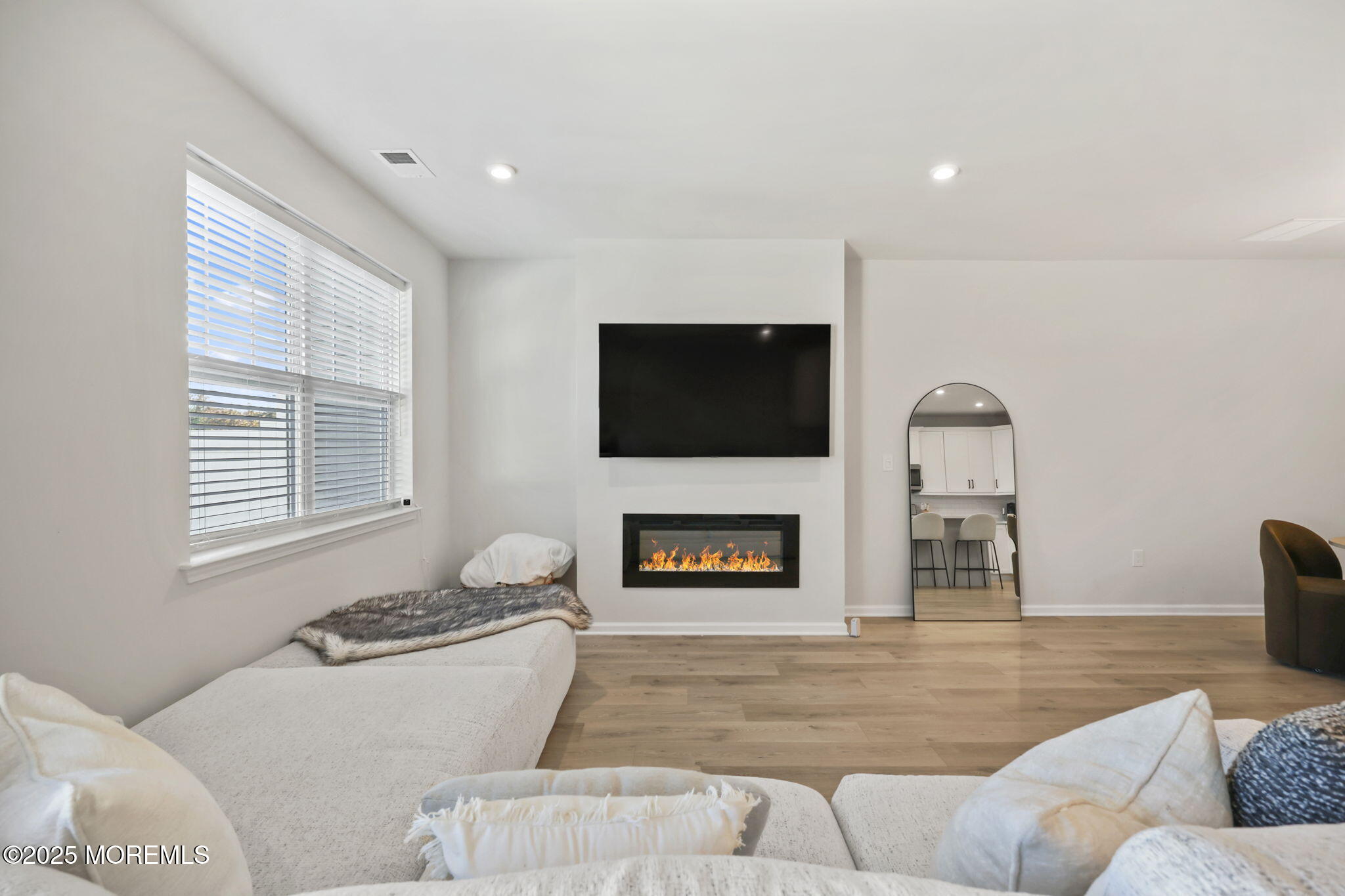 16 Chapel Lane Neptune, NJ 07753 - Photo 12 of 26 a living room with furniture and a fireplace