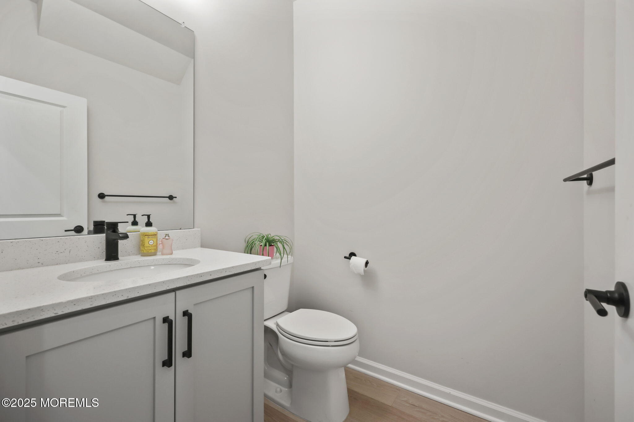 16 Chapel Lane Neptune, NJ 07753 - Photo 15 of 26 a bathroom with a sink a toilet and a mirror