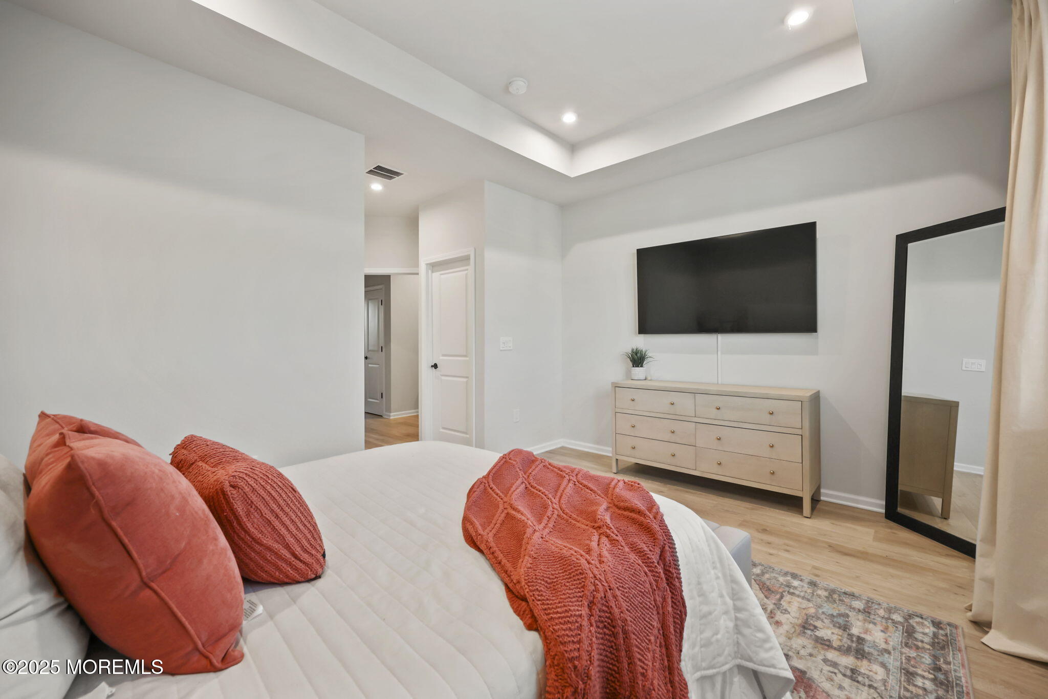 16 Chapel Lane Neptune, NJ 07753 - Photo 18 of 26 a bedroom with a bed and a flat screen tv