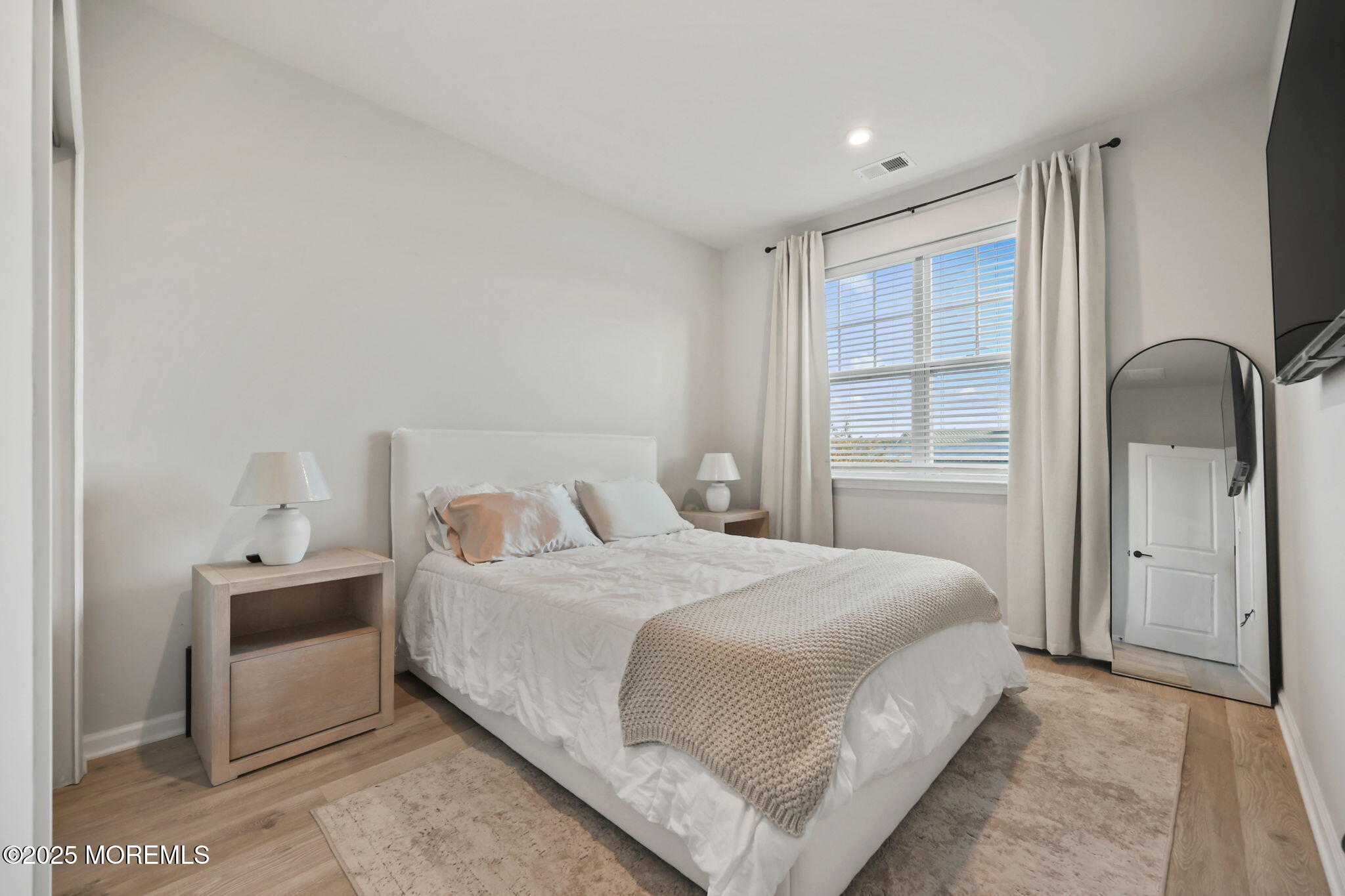 16 Chapel Lane Neptune, NJ 07753 - Photo 21 of 26 a bedroom with a bed and a window