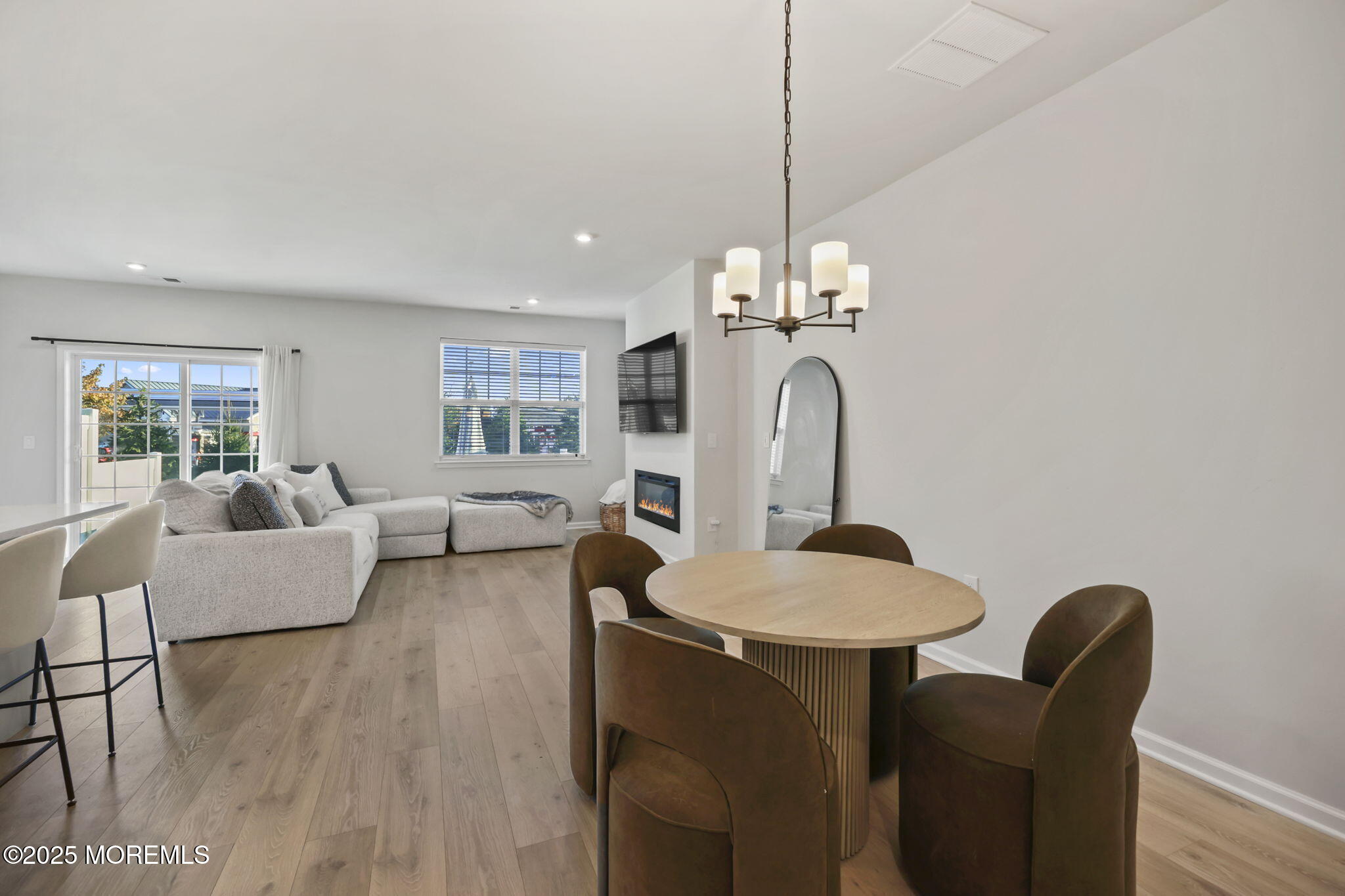 16 Chapel Lane Neptune, NJ 07753 - Photo 7 of 26 a living room with couches a table and chairs