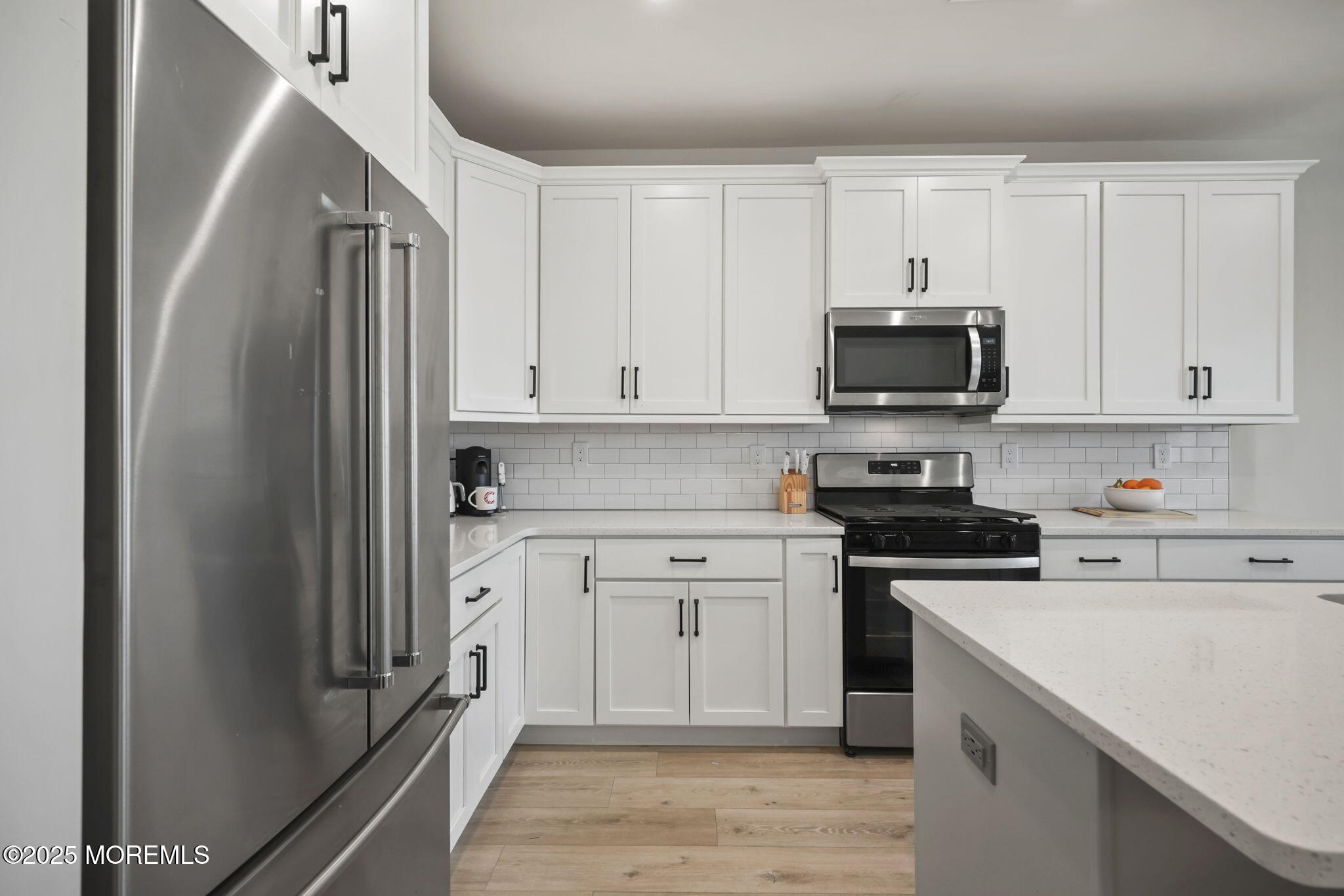 16 Chapel Lane Neptune, NJ 07753 - Photo 9 of 26 a kitchen with stainless steel appliances a refrigerator stove and sink