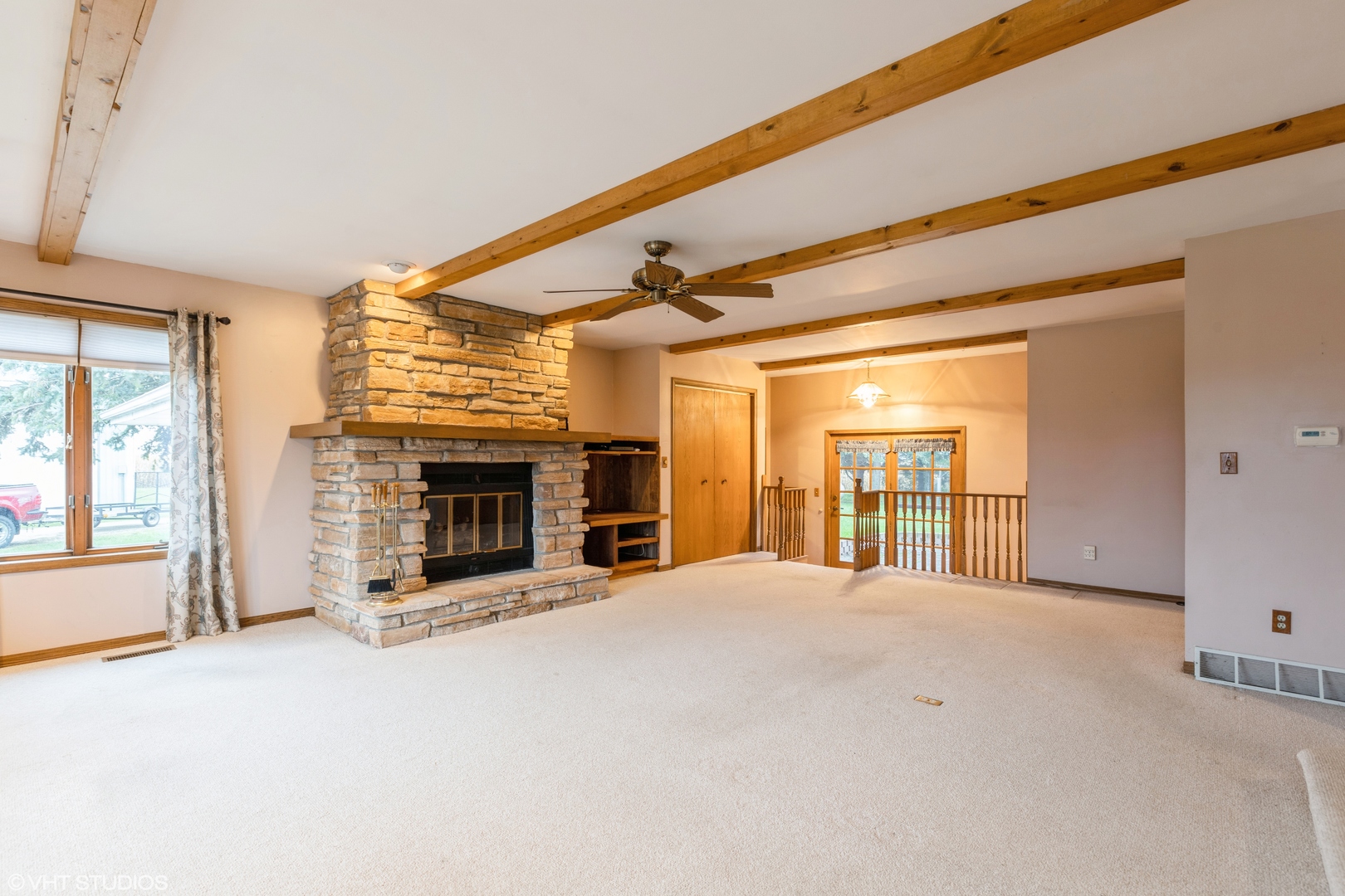 6222 Rich Road DeKalb, IL 60115 - Photo 4 of 31 a view of an empty room with a fireplace and a window