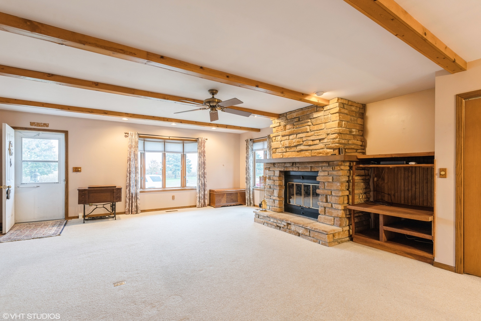 6222 Rich Road DeKalb, IL 60115 - Photo 5 of 31 a view of a livingroom with furniture a fireplace and windows