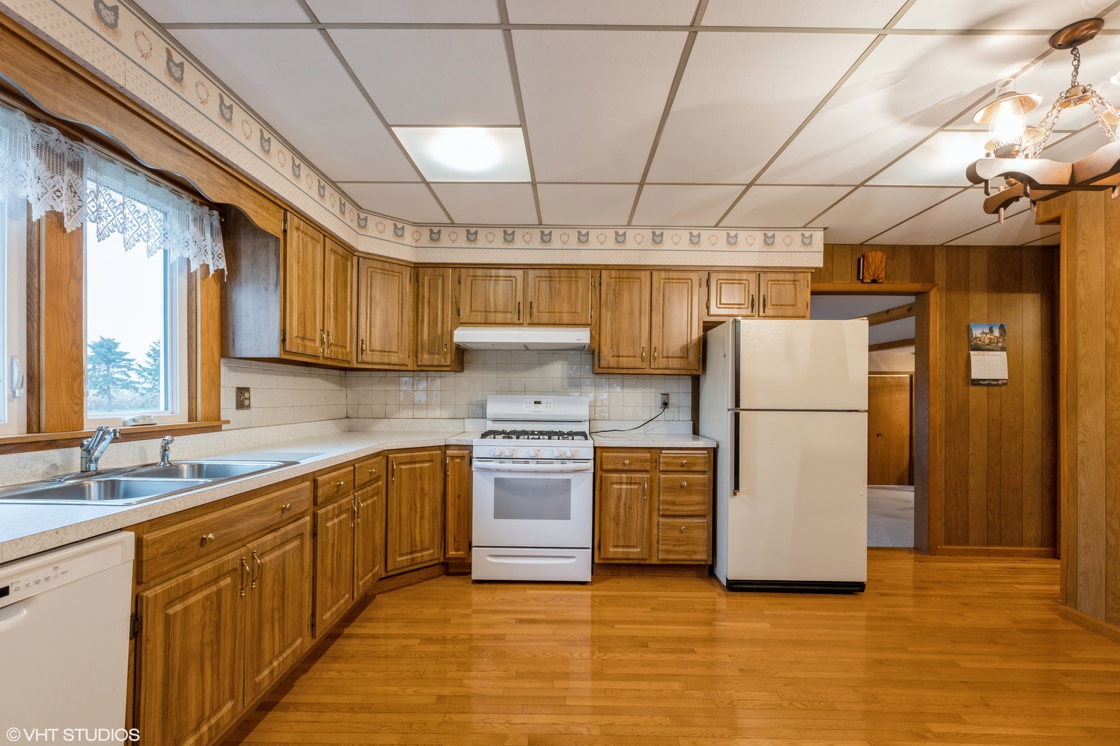 6222 Rich Road DeKalb, IL 60115 - Photo 9 of 31 a kitchen with refrigerator and cabinets