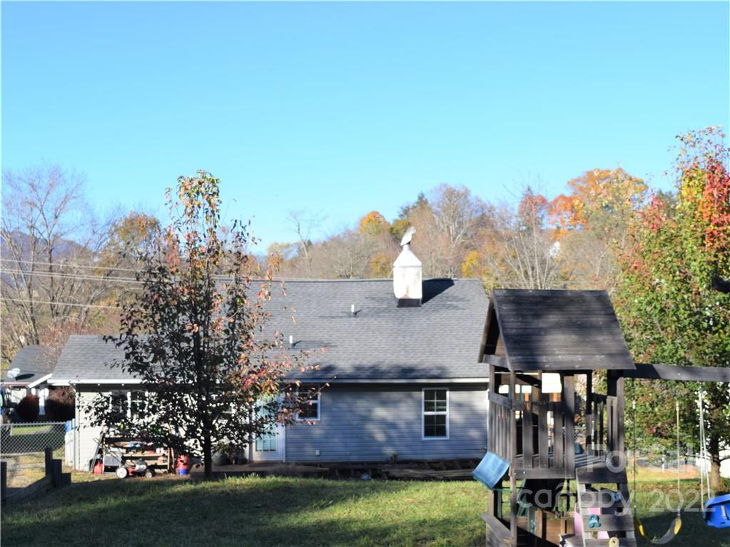 133 Substation Road Canton, NC 28716 - Photo 1 of 8 a view of house with a yard and a sitting area