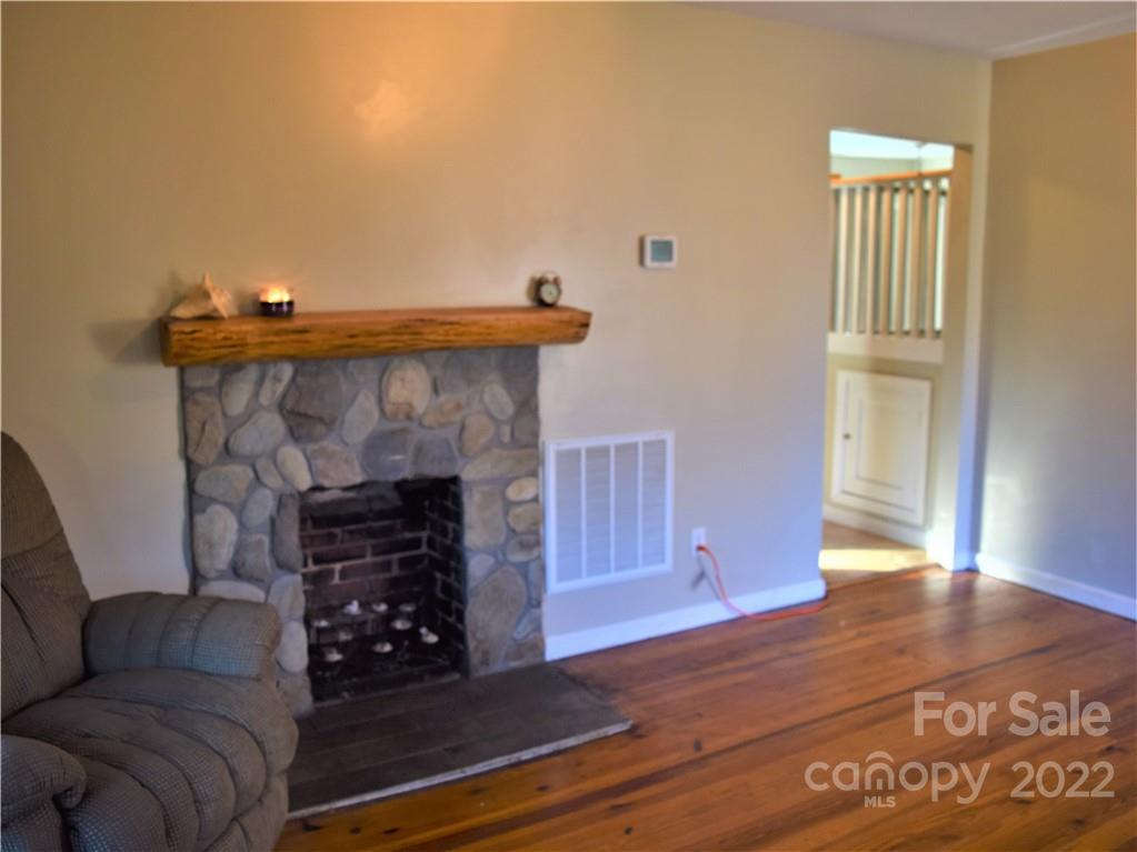 133 Substation Road Canton, NC 28716 - Photo 4 of 8 a living room with furniture and a fireplace