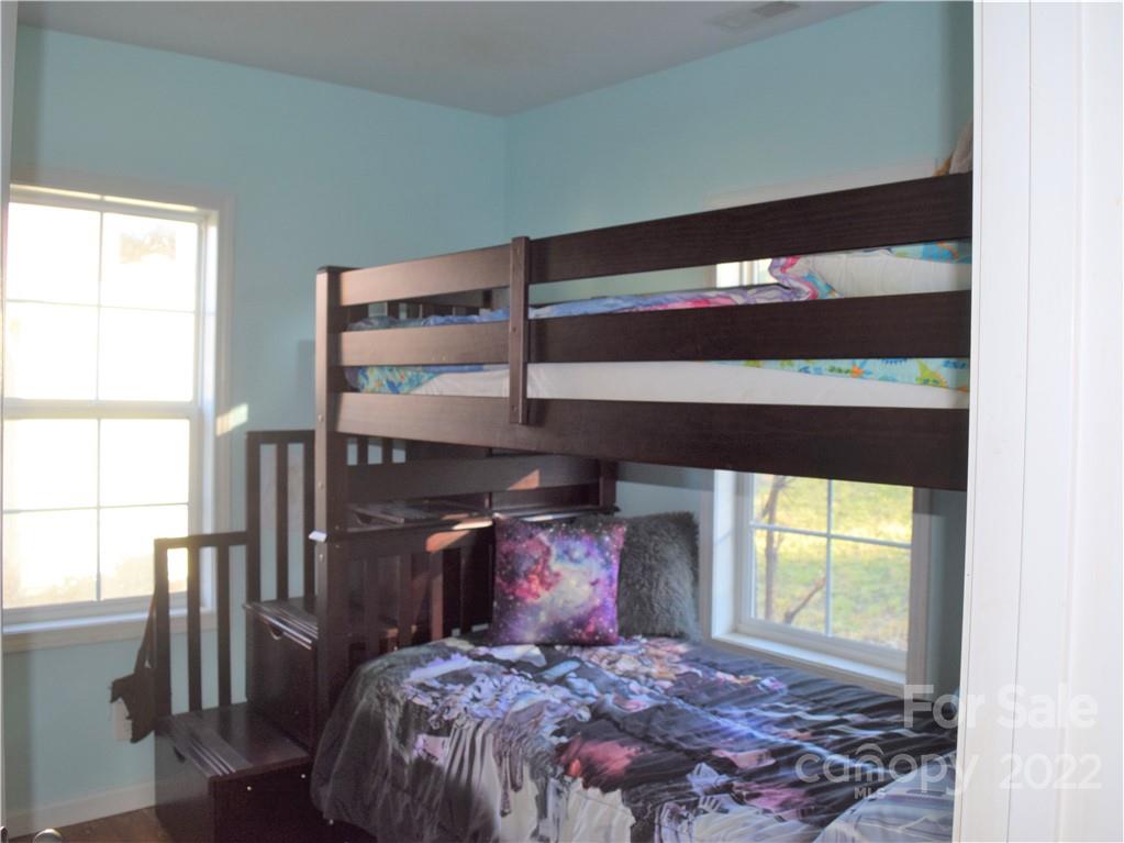133 Substation Road Canton, NC 28716 - Photo 6 of 8 a bed sitting in a bedroom next to a window
