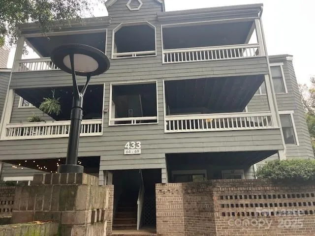 a view of a house with large windows