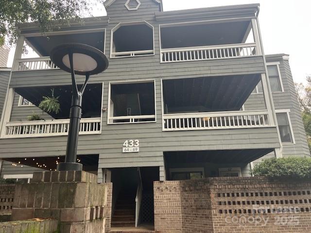 a view of a house with large windows