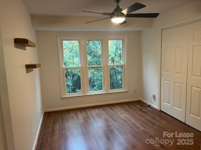 433 West 8th Street, Unit 66 Charlotte, NC 28202 - Photo 14 of 24 a view of an empty room with wooden floor and a window