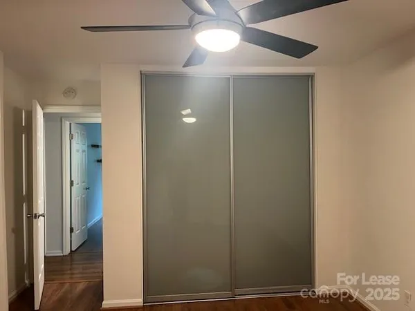 a view of front door with wooden floor