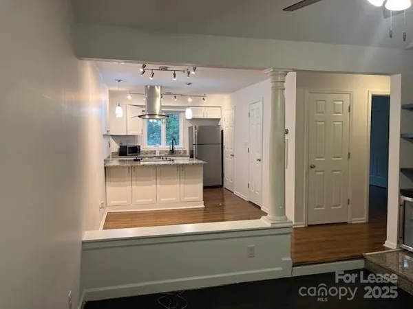a view of a porch with wooden floor