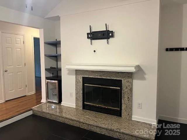a fireplace with a hallway