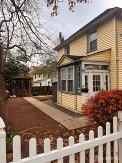 a front view of a house with garden