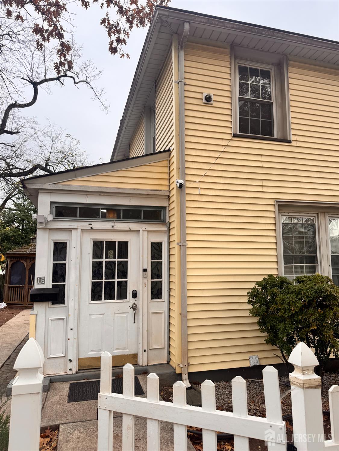 16 Curtis Place New Brunswick, NJ 08901 - Photo 2 of 18 a view of a house with a window and stairs