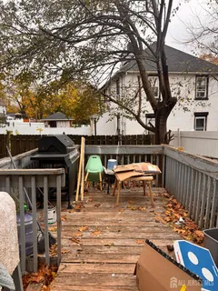 a view of a chairs and table on the deck