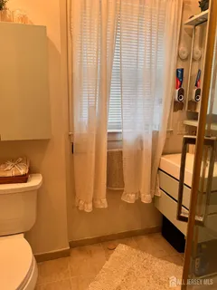 a bathroom with a sink and toilet