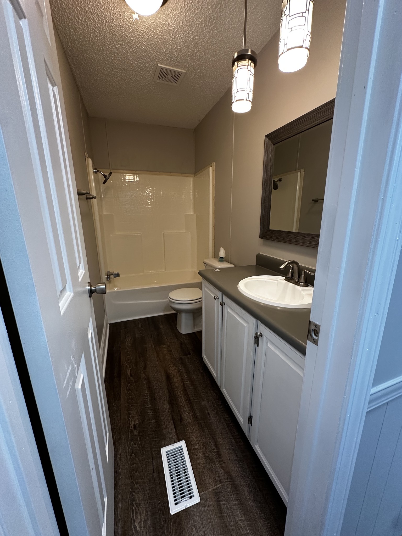 599 Defeated Creek Highway Carthage, TN 37030 - Photo 17 of 22 a bathroom with a sink a mirror and a light fixture