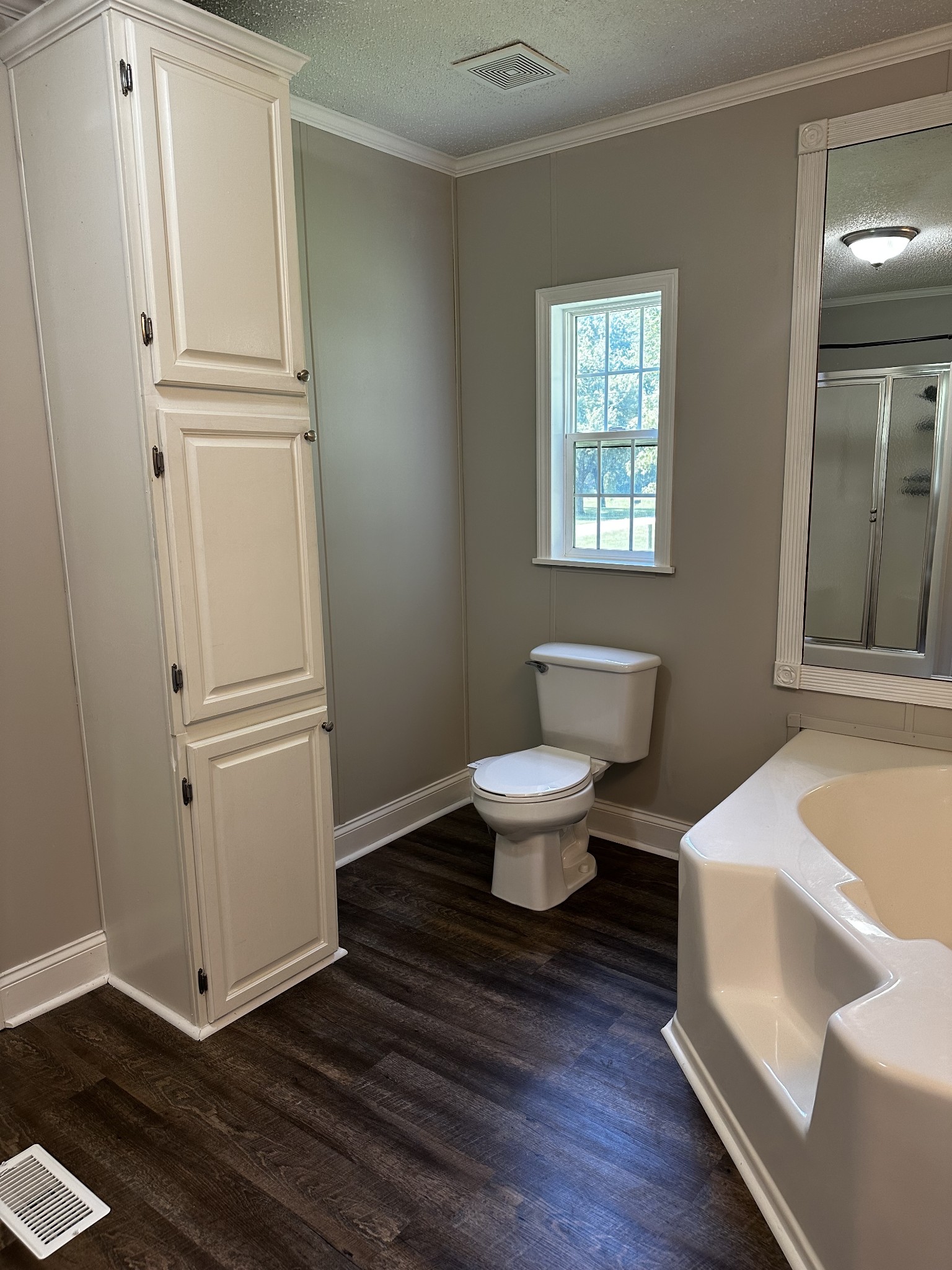 599 Defeated Creek Highway Carthage, TN 37030 - Photo 18 of 22 a bathroom with a sink a toilet a window and shower