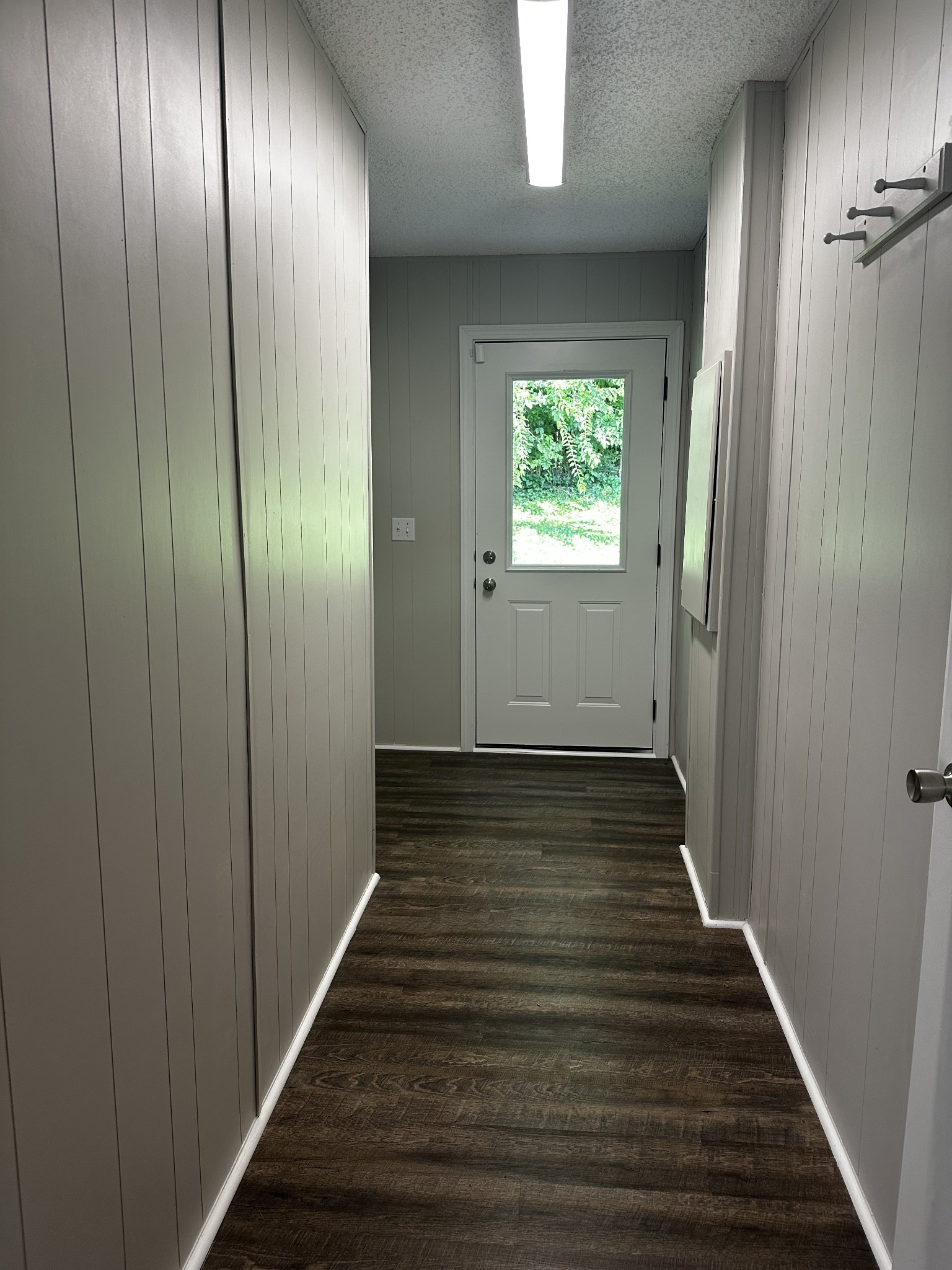 599 Defeated Creek Highway Carthage, TN 37030 - Photo 5 of 22 a view of a hallway with wooden floor and staircase