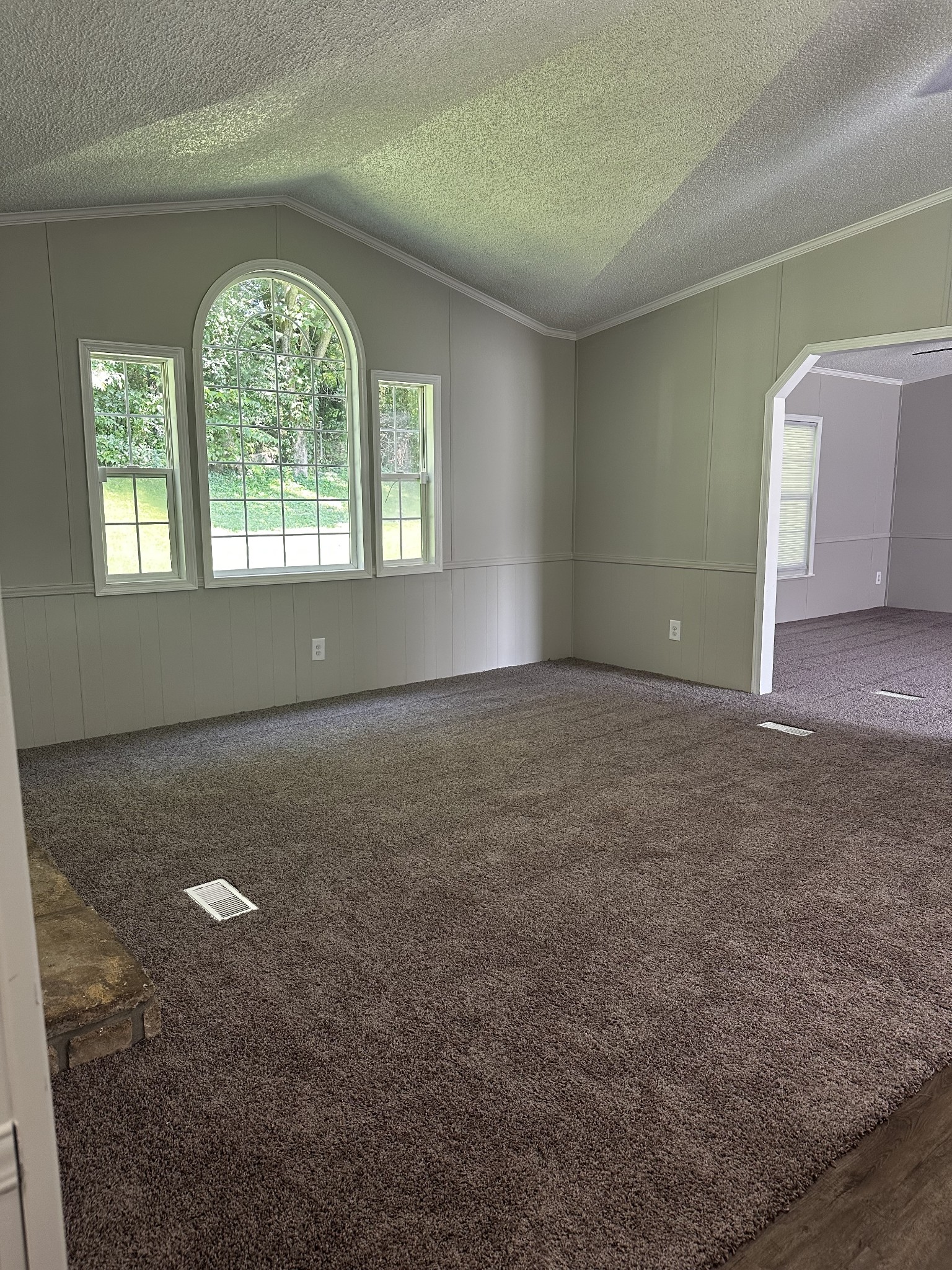 599 Defeated Creek Highway Carthage, TN 37030 - Photo 6 of 22 an empty room with a empty space and windows