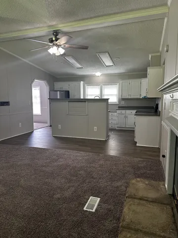 a view of a kitchen with a sink and cabinets