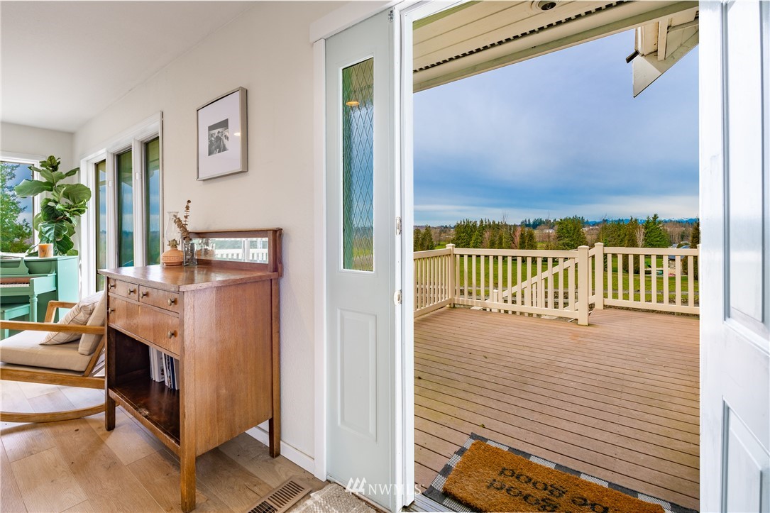 245 Ridgeview Street Sumas, WA 98295 - Photo 6 of 35 a view of a balcony with furniture and floor to ceiling window