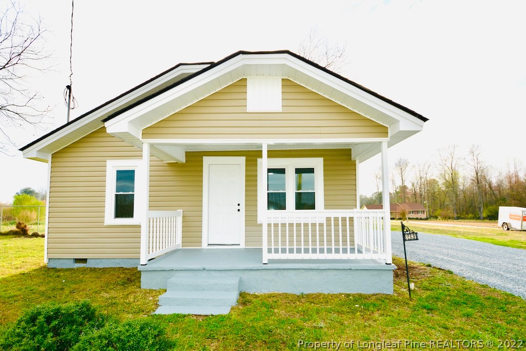 8493 Godwin-Falcon Road Godwin, NC 28344 - Photo 1 of 19 a front view of a house with a yard