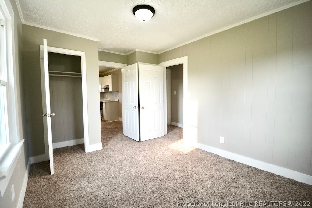 8493 Godwin-Falcon Road Godwin, NC 28344 - Photo 14 of 19 an empty room with closet and a bathroom