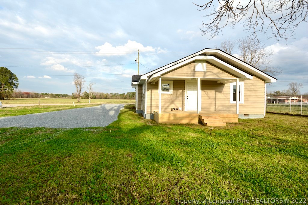 8493 Godwin-Falcon Road Godwin, NC 28344 - Photo 16 of 19 a view of a house with a yard