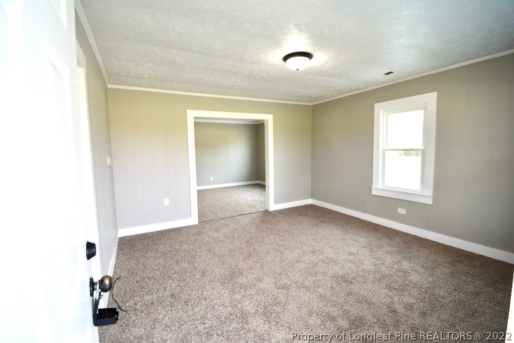8493 Godwin-Falcon Road Godwin, NC 28344 - Photo 2 of 19 an empty room with windows and closet