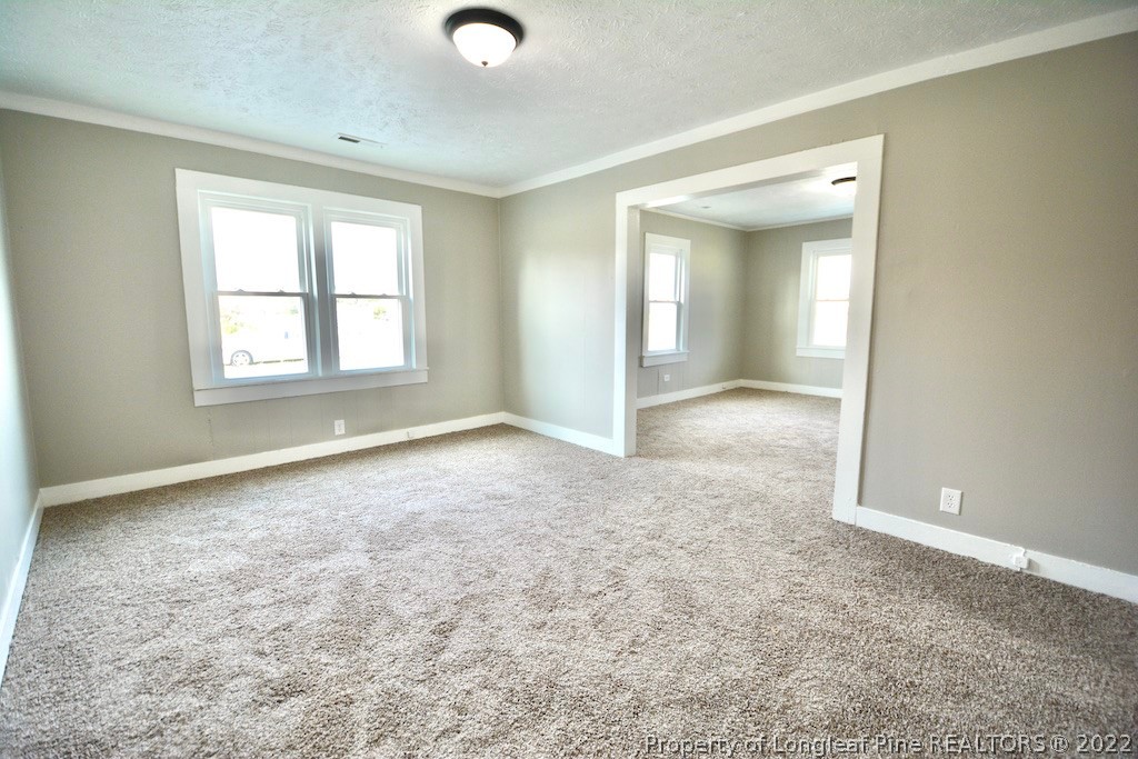 8493 Godwin-Falcon Road Godwin, NC 28344 - Photo 3 of 19 an empty room with windows and closet
