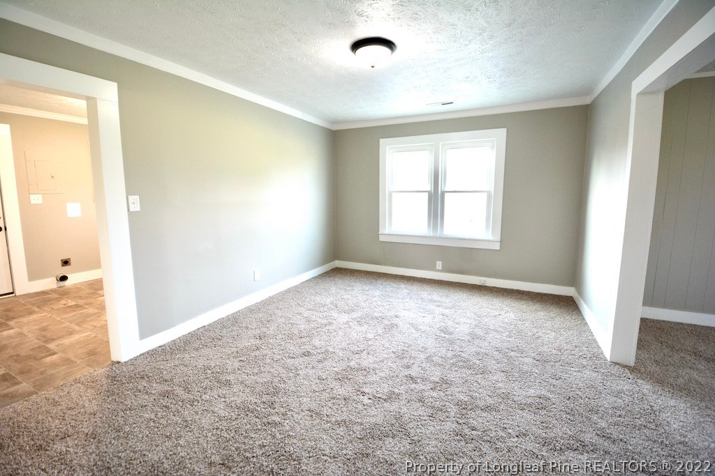 8493 Godwin-Falcon Road Godwin, NC 28344 - Photo 4 of 19 an empty room with windows and closet