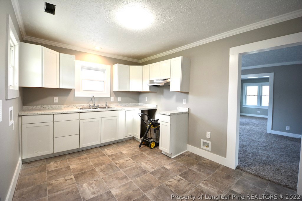 8493 Godwin-Falcon Road Godwin, NC 28344 - Photo 6 of 19 a kitchen with a sink cabinets and window