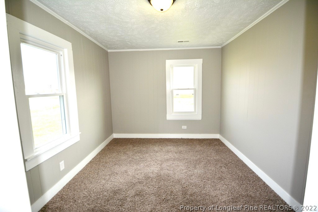 8493 Godwin-Falcon Road Godwin, NC 28344 - Photo 8 of 19 an empty room with windows