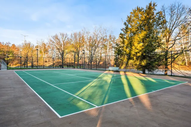a view of an outdoor space and tennis court