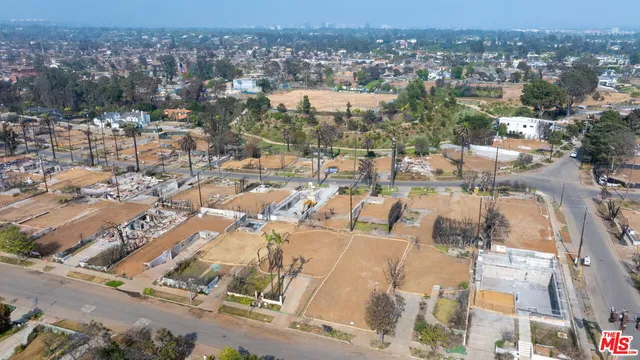 an aerial view of a city with lots of residential buildings