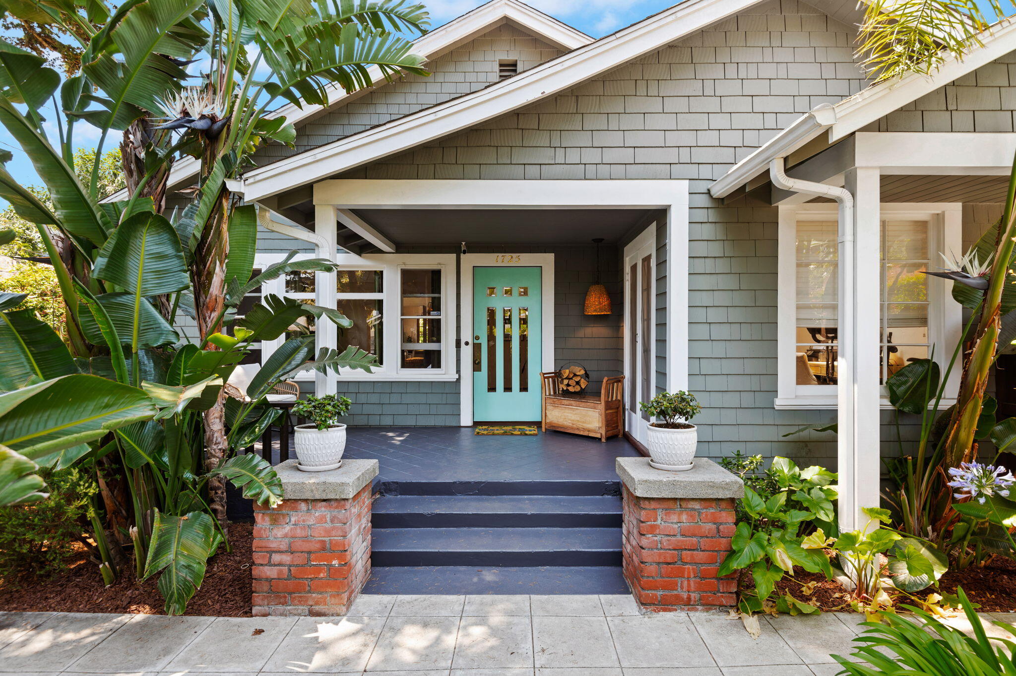 1725 San Andres Street Santa Barbara, CA 93101 - Photo 1 of 44 a front view of a house with potted plants