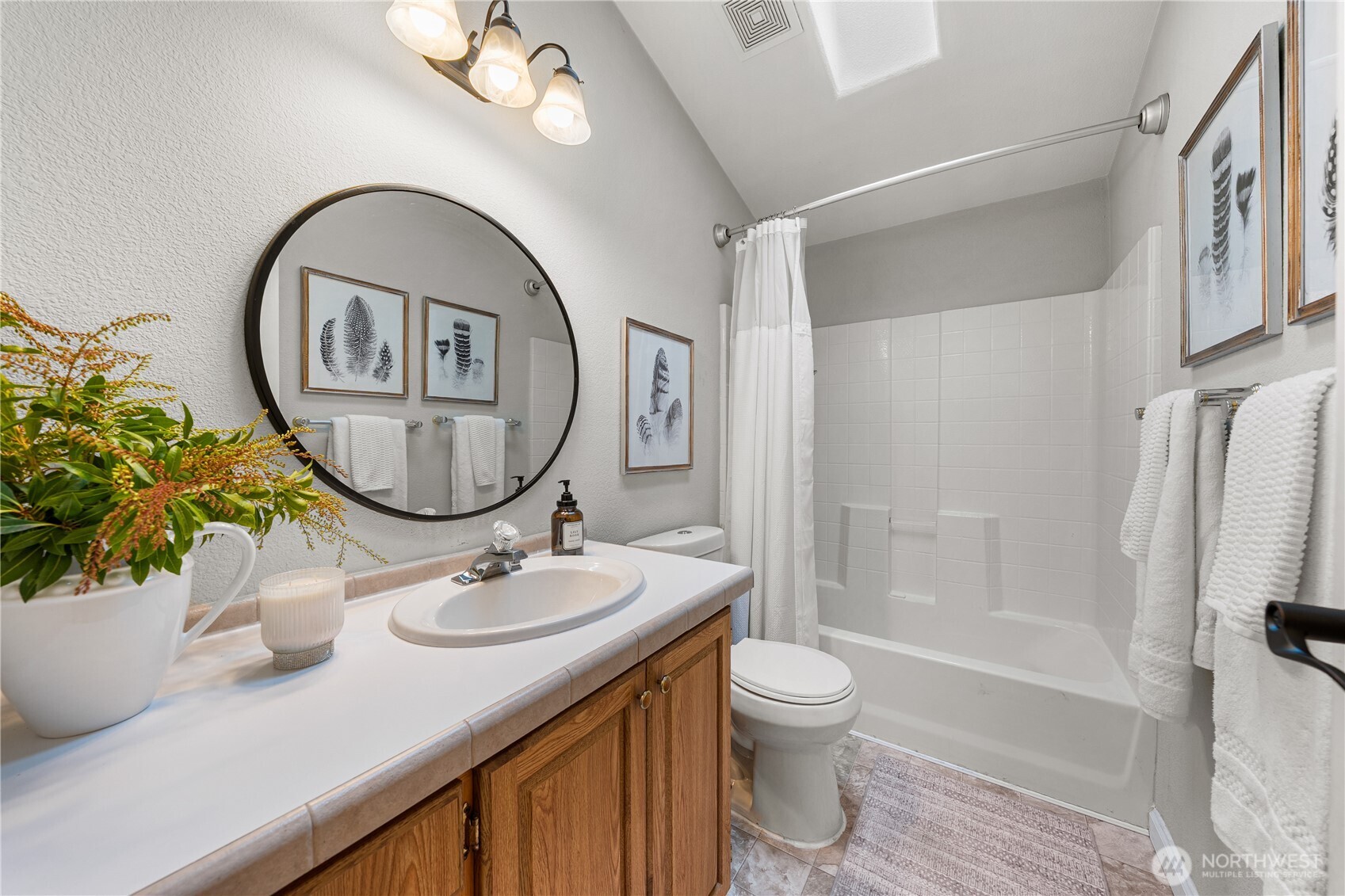 23835 15th Avenue Southeast, Unit 40 Bothell, WA 98021 - Photo 14 of 39 a bathroom with a sink and a mirror