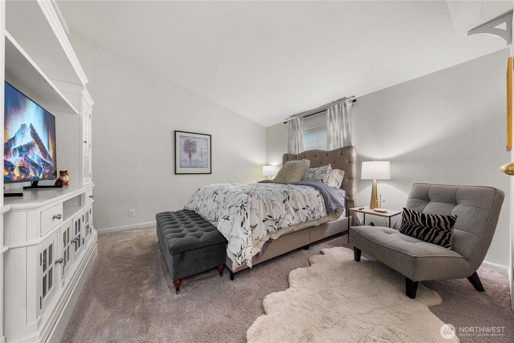 23835 15th Avenue Southeast, Unit 40 Bothell, WA 98021 - Photo 15 of 39 a bedroom with furniture and a flat screen tv