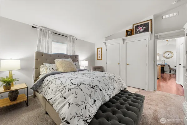 a bedroom with bed and a window