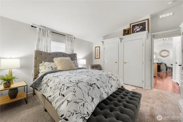 a bedroom with bed and a window